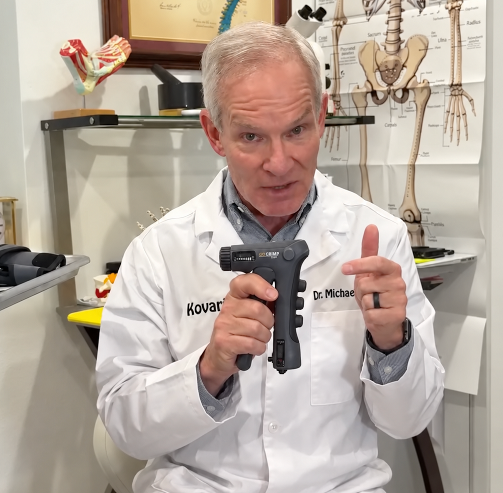 Doctor in white coat holding HandEase device